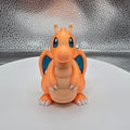 Small figurine of a cartoon character on a textured surface
